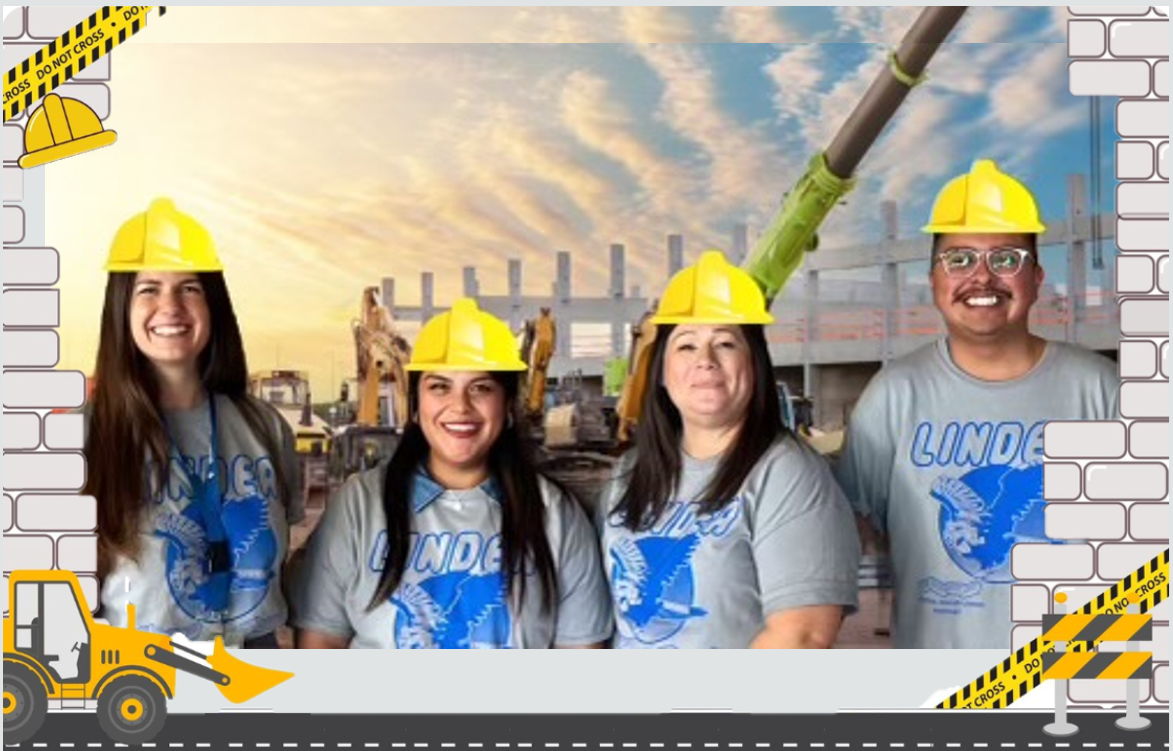 Picture of teachers in a construction site holding shovels in front of heavy-duty construction equipment.