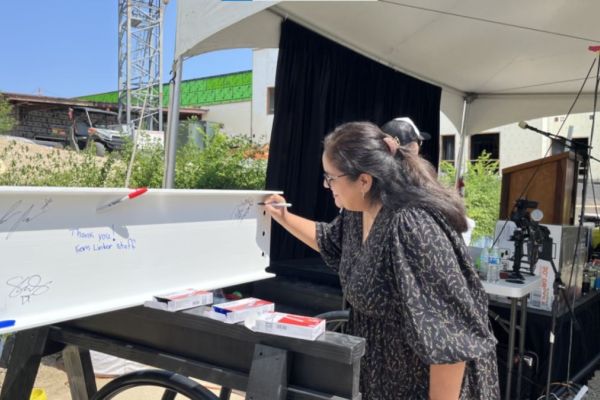 Principal Estep Signs Last Beam